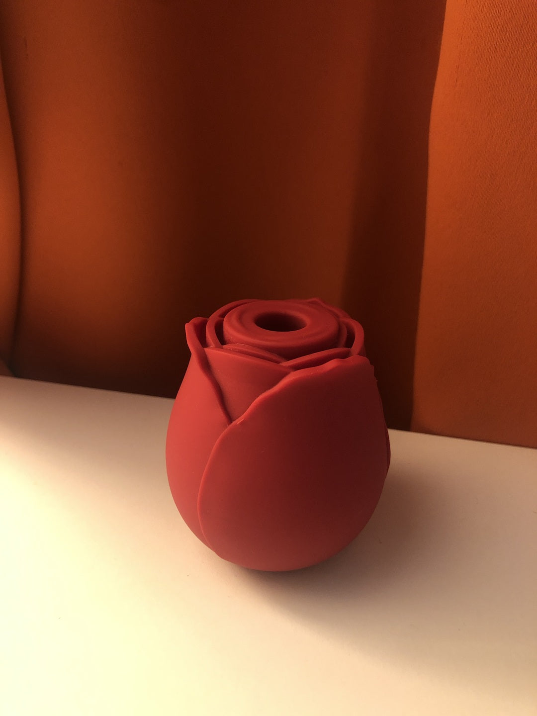 Rose toy in red standing on a shelf, real customer photo of the Rose Toy Vibrator
